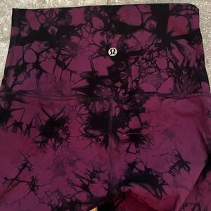 Lululemon, Size 4, hi-waisted/ full length leggings. Maroon and black pattern.